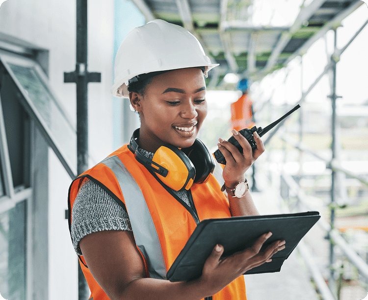 Smiling woman holding laptop